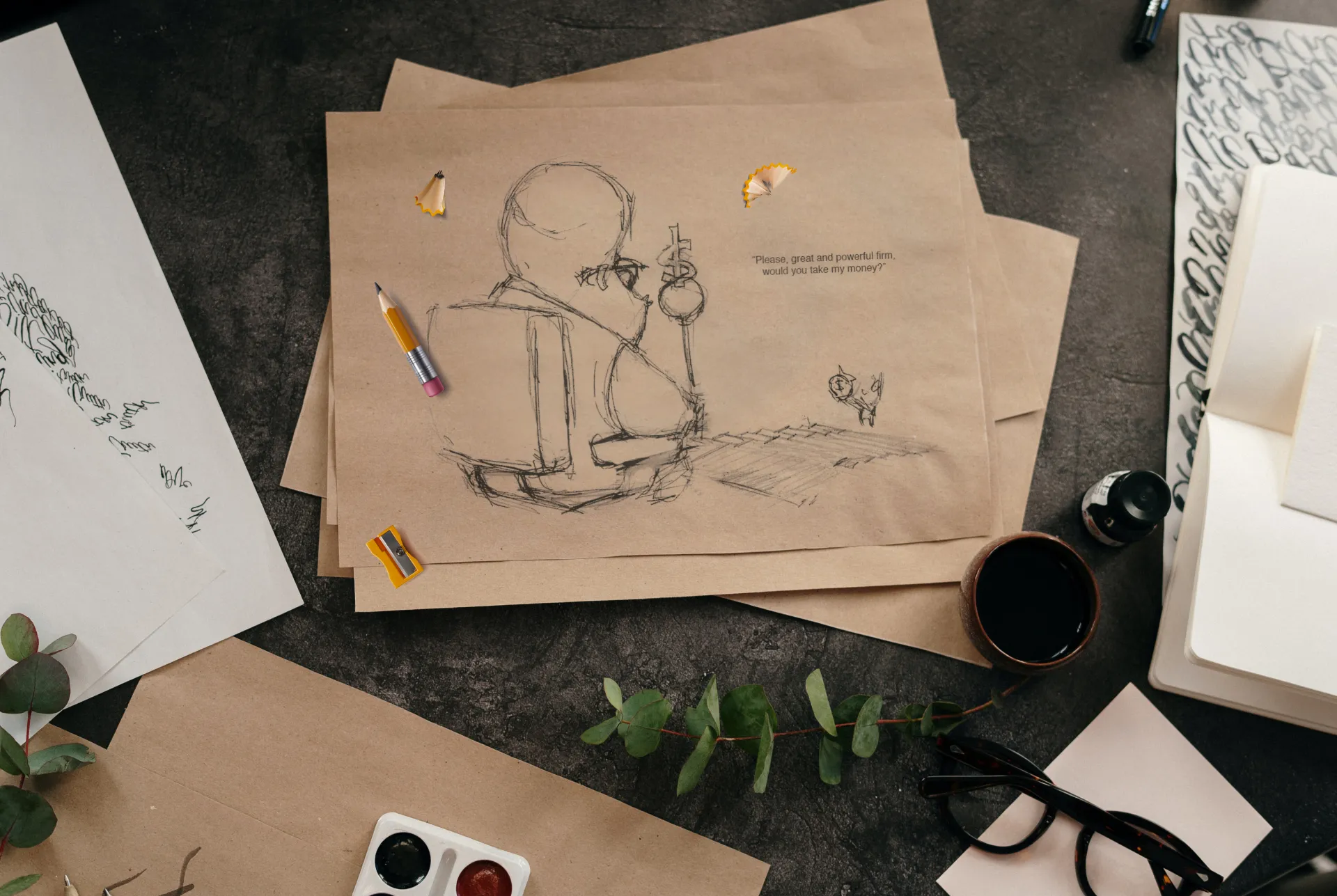 Artist's work desk with draft sketches for a cartoon drawing